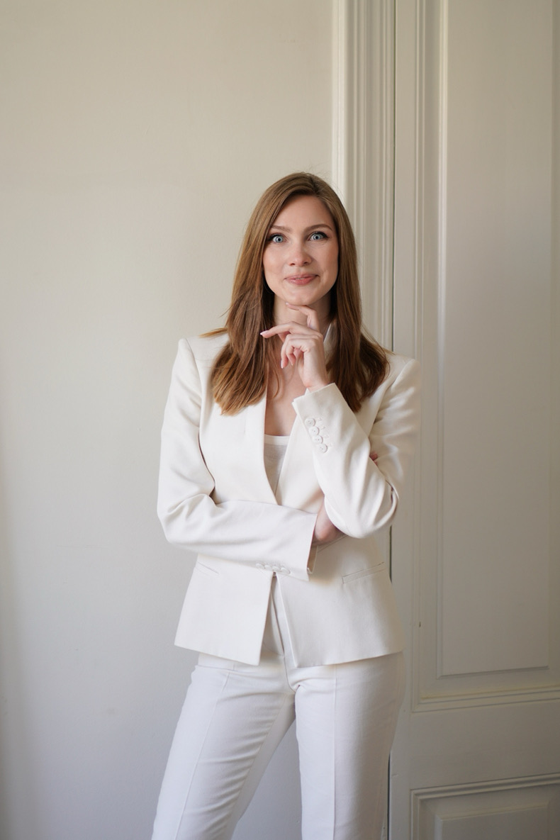 Kate Prykhodko standing in a bright Barcelona apartment